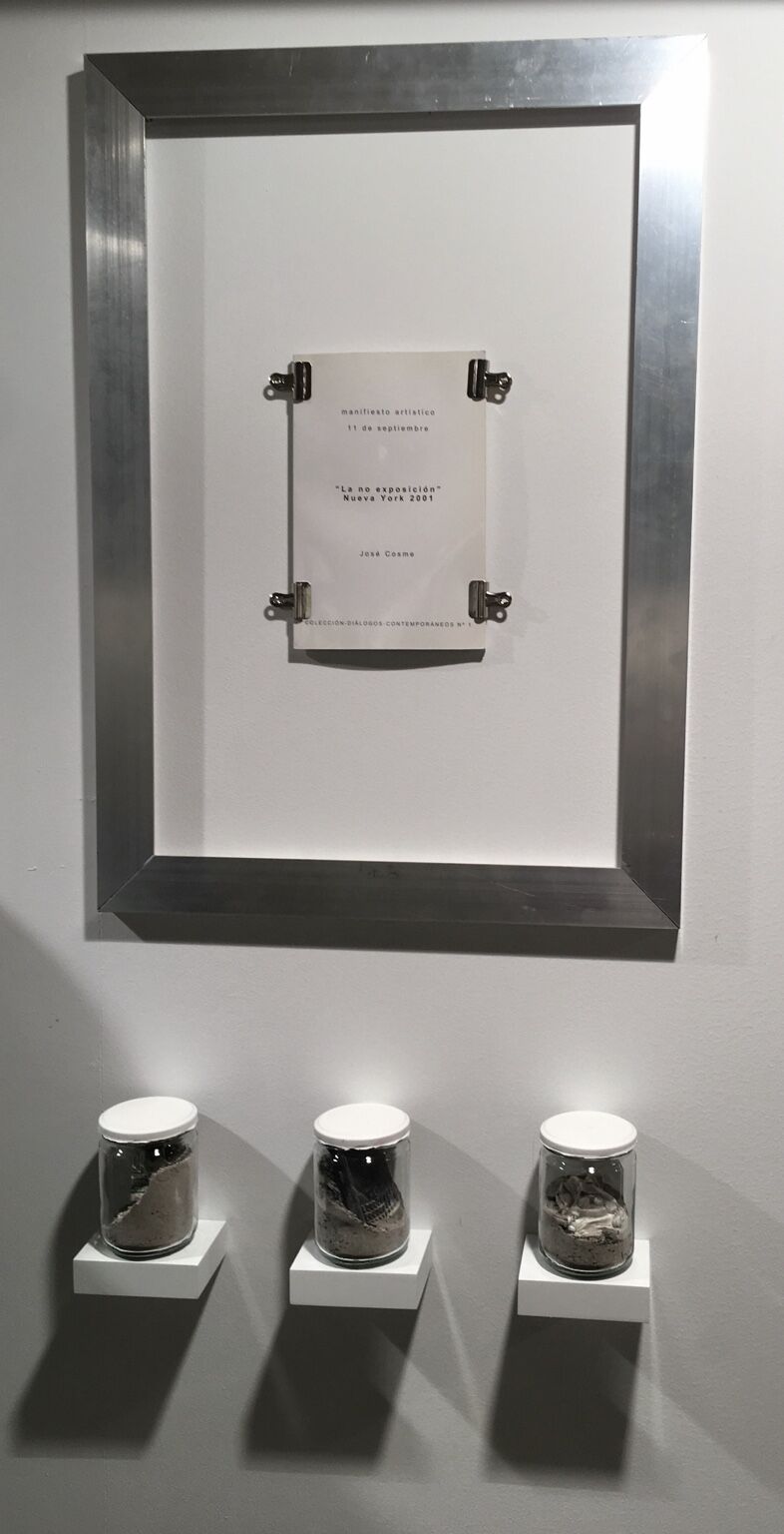 Manifiesto La NO Exposición by José Cosme, framed manifesto above three vessels containing ashes and material remains