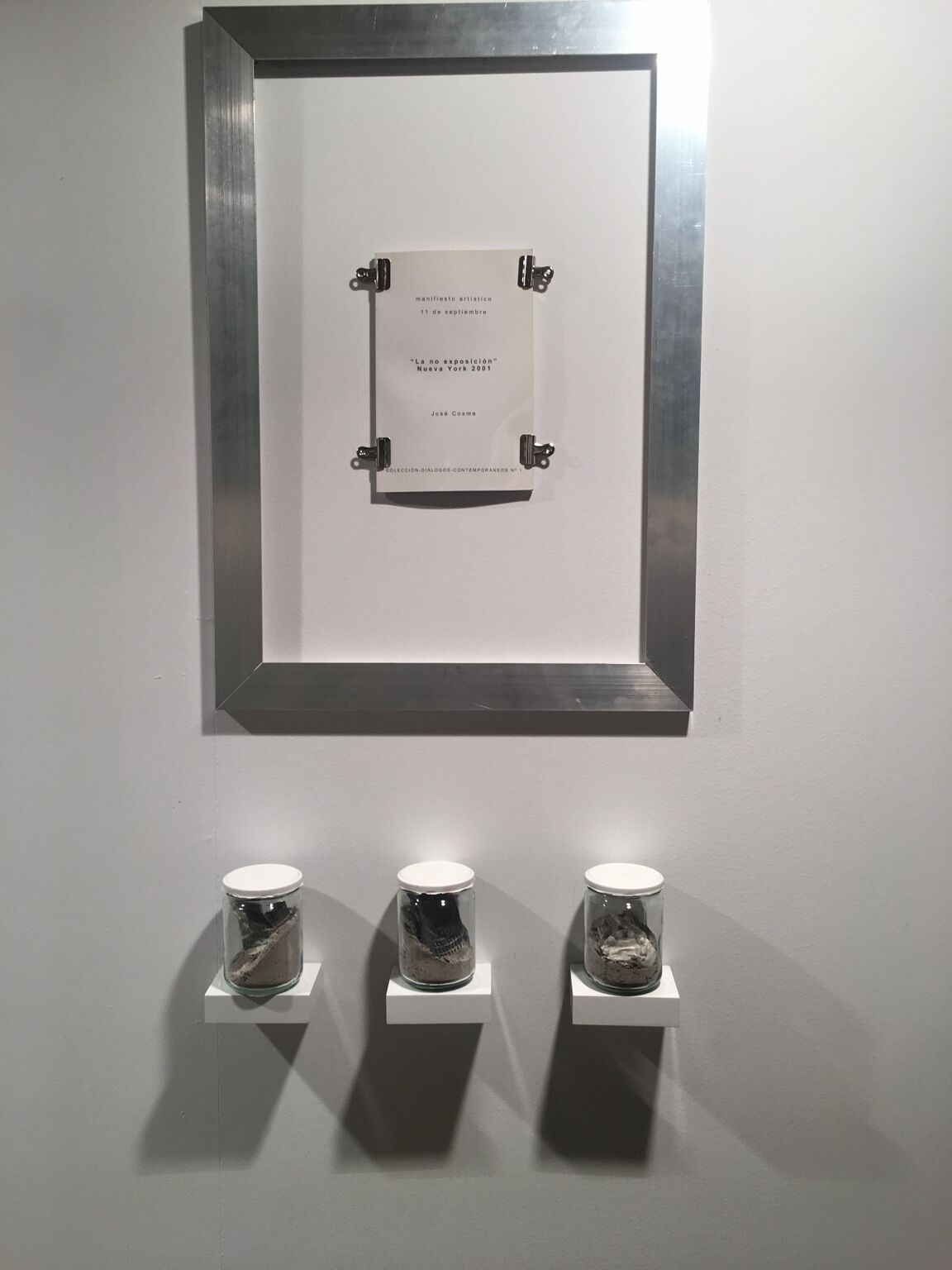 Manifiesto La NO Exposición by José Cosme, book-object and three sealed vessels installed on the wall