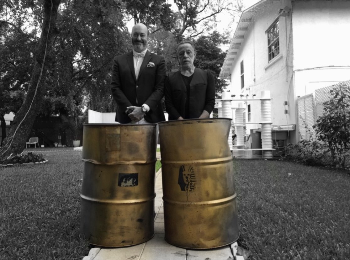 Performance documentation with two industrial barrels outdoors