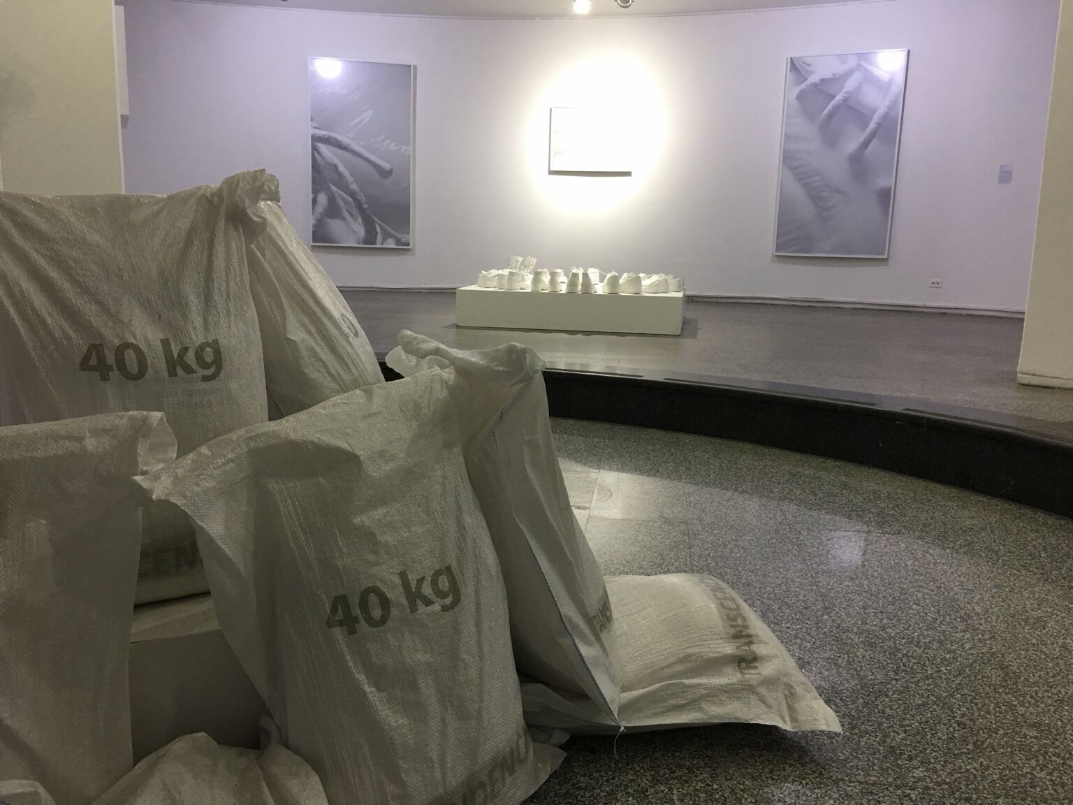 El Todo y la Nada by José Cosme, installation view with material sacks and white sculptures